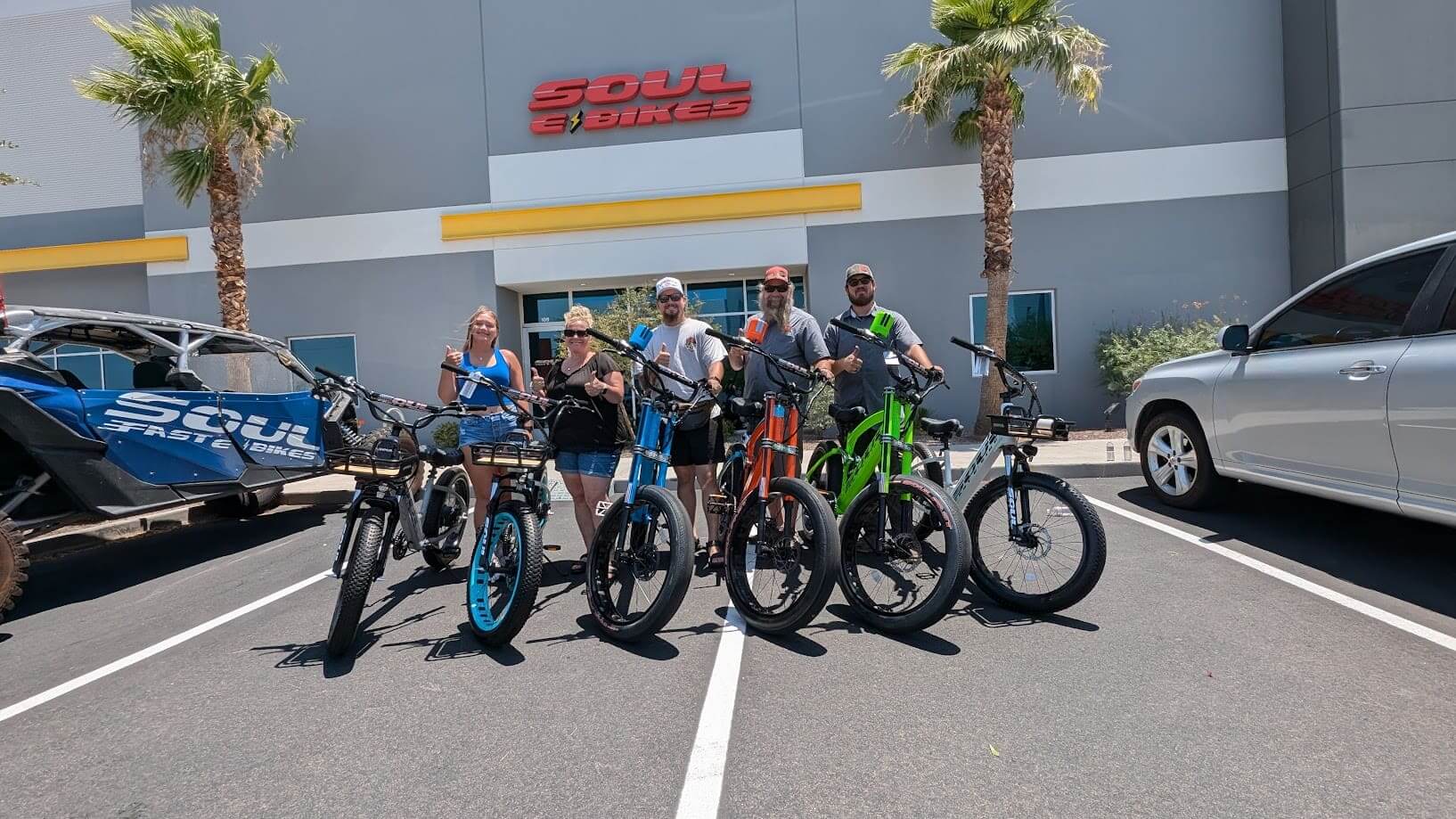 Group posing with bicycles outside Soul Bikes.