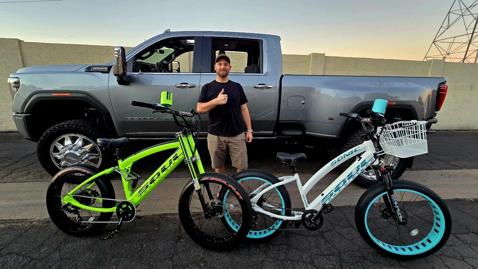Man with pickup truck and two bicycles.