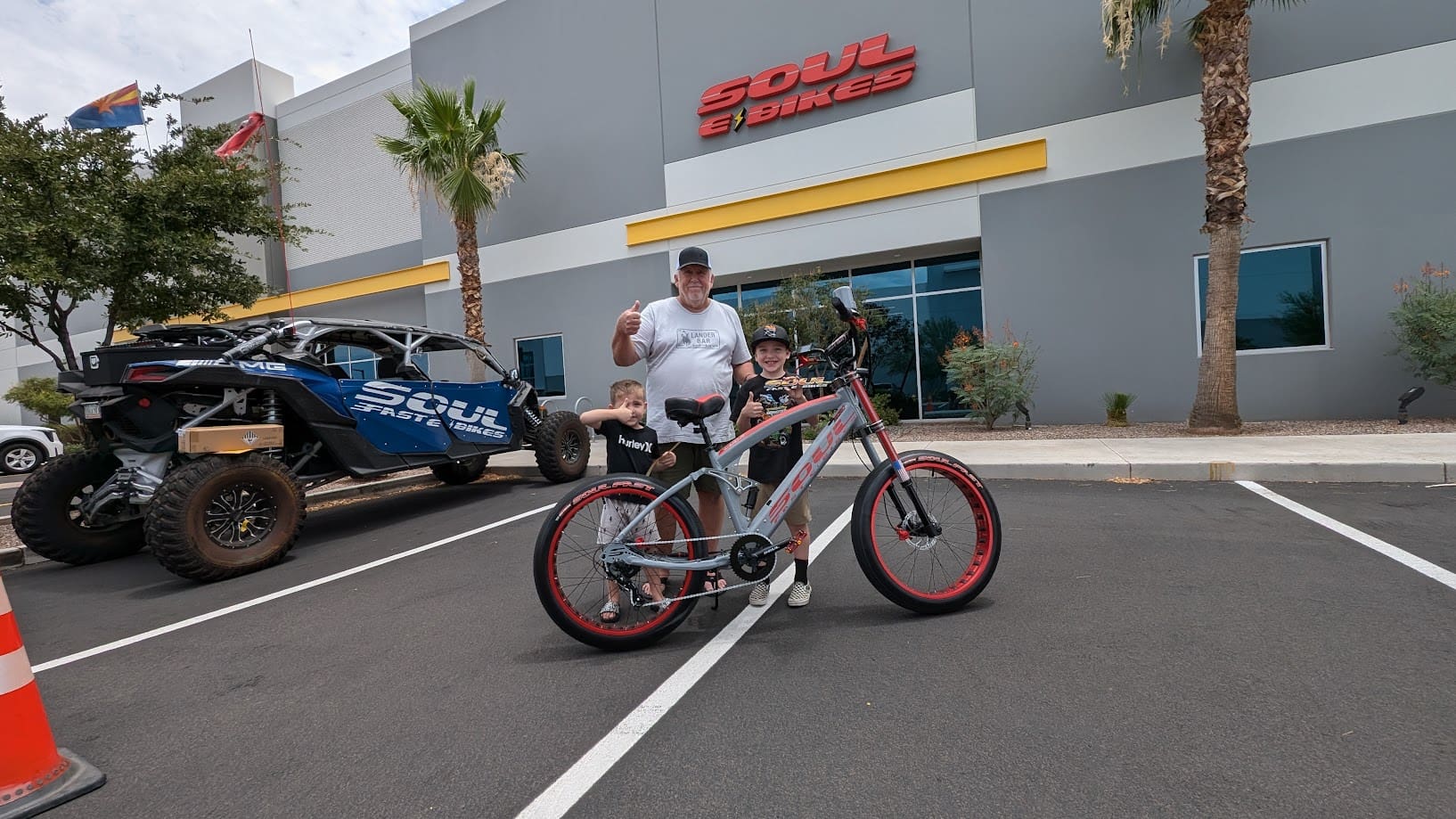 Man posing with bike outside Soul E Bikes.