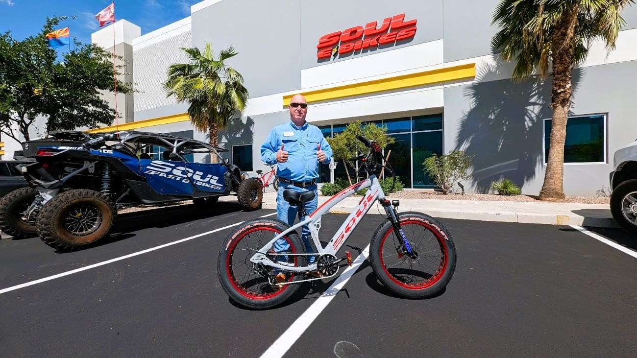 Man standing with bike outside Soul premises.
