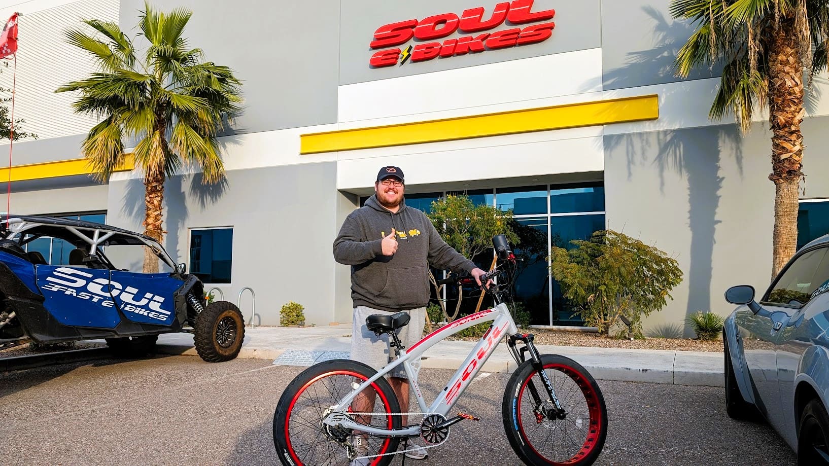 Man with bike in front of Soul store.