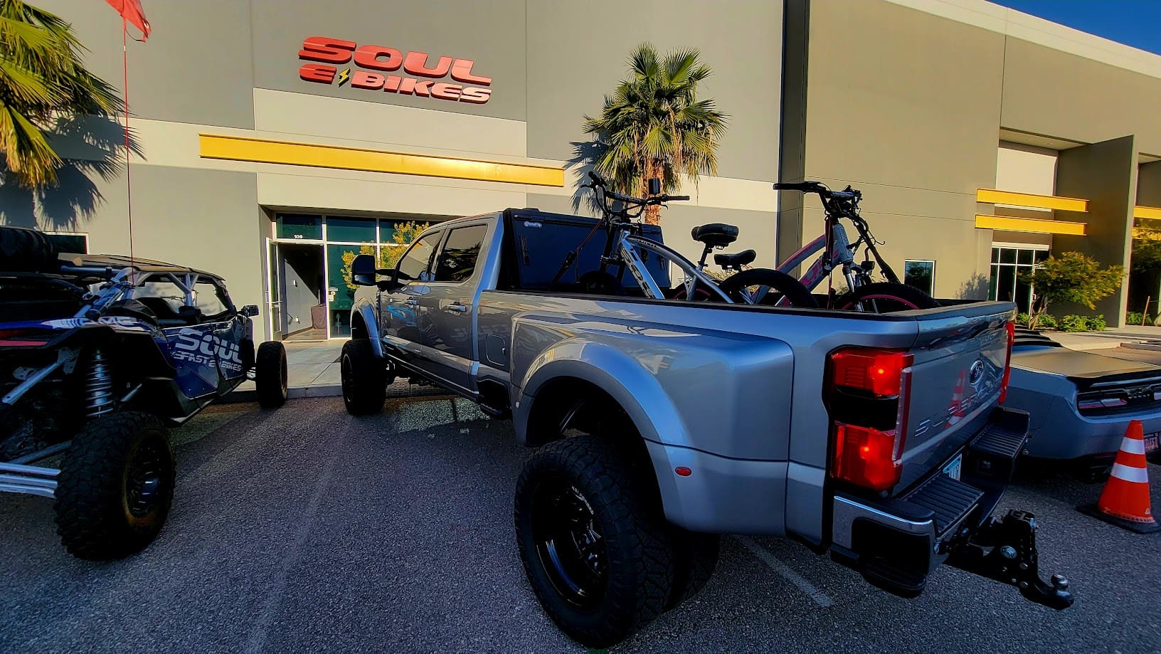 Truck parked outside a bike store.
