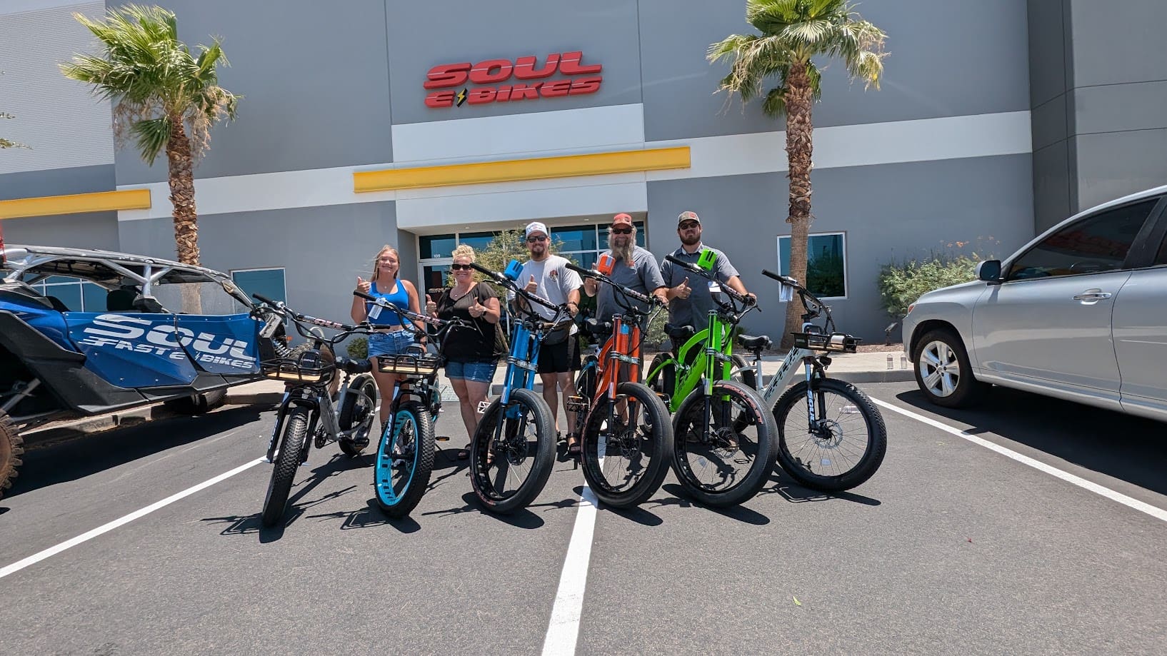 Group with bicycles outside Soul Fast Bikes.