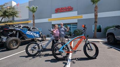 People with bicycles outside Soul showroom.
