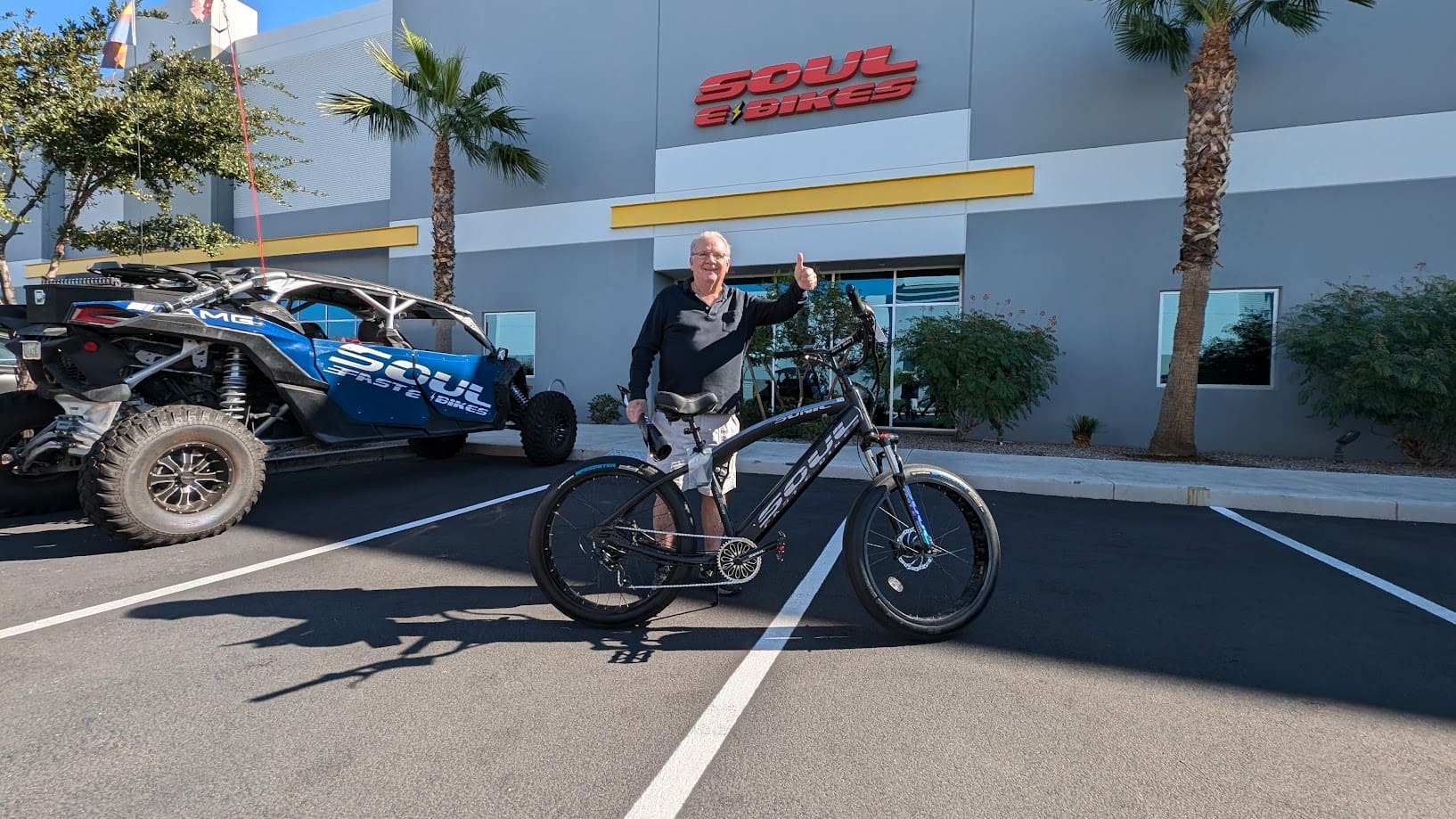 Man standing with bike outside Soul Bikes.