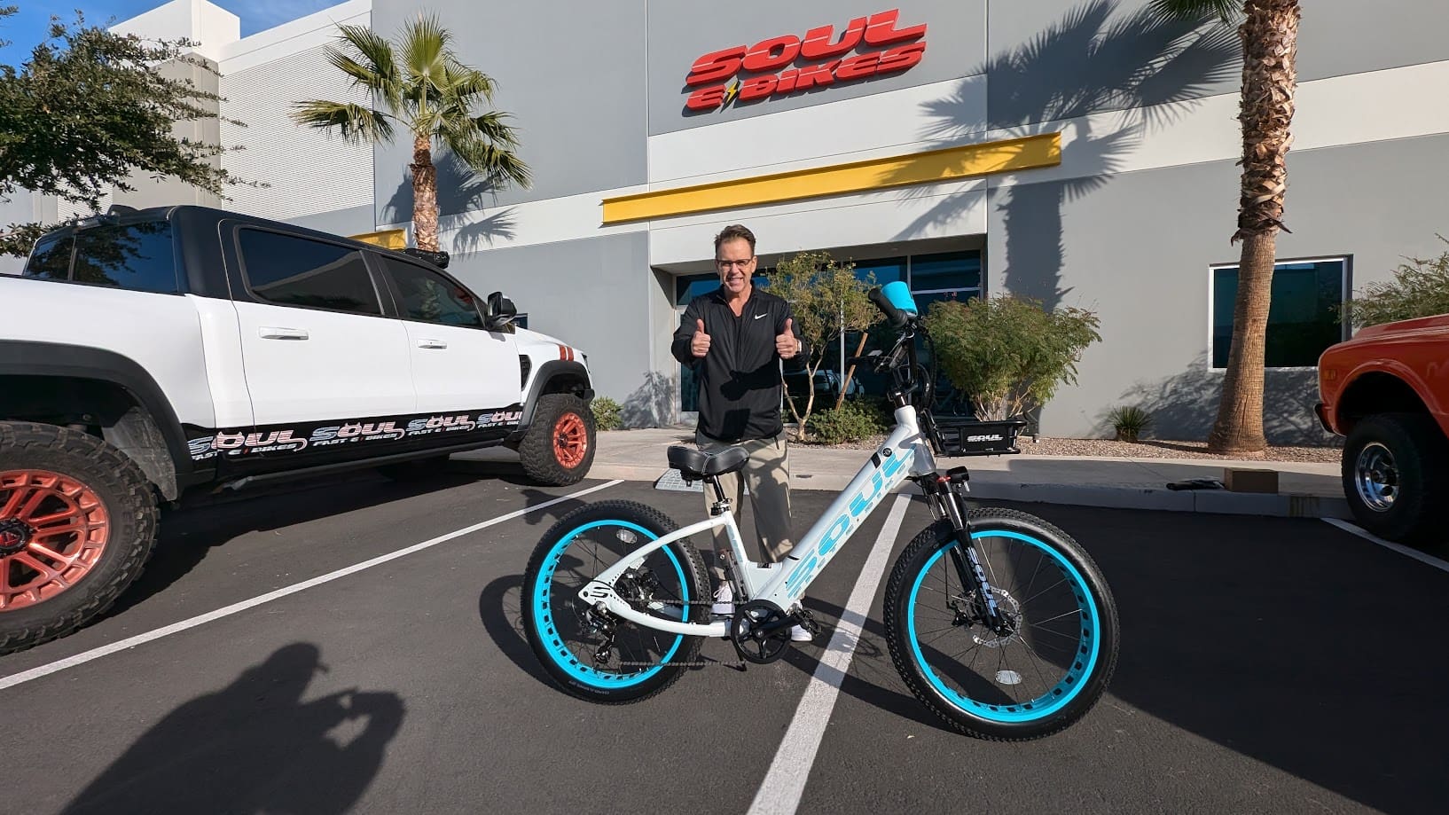 Man with bike outside Soul Beach Cruisers.