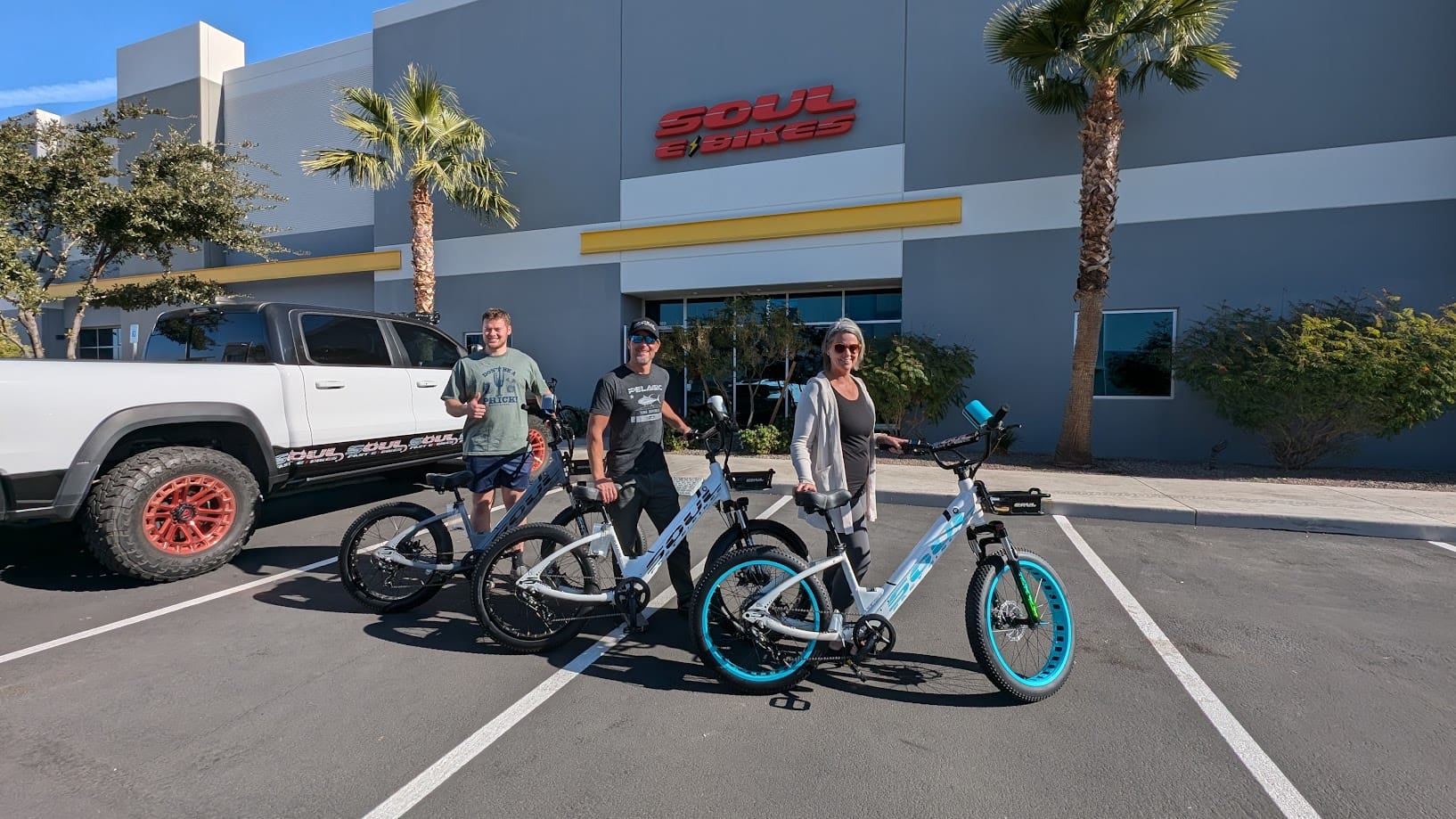 People with e-bikes outside Soul Bikes shop.