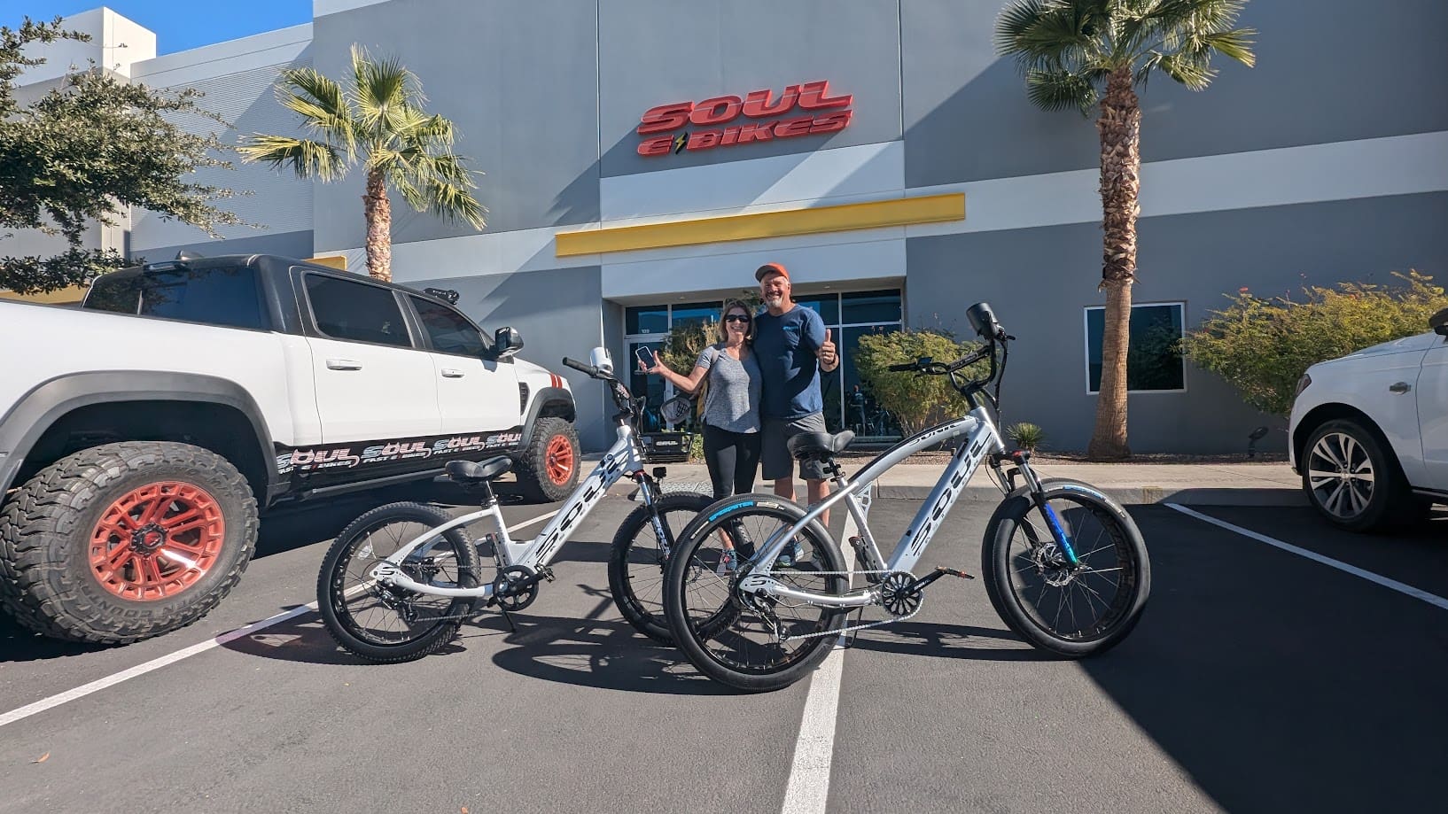 People with bicycles outside Soul Bikes store.