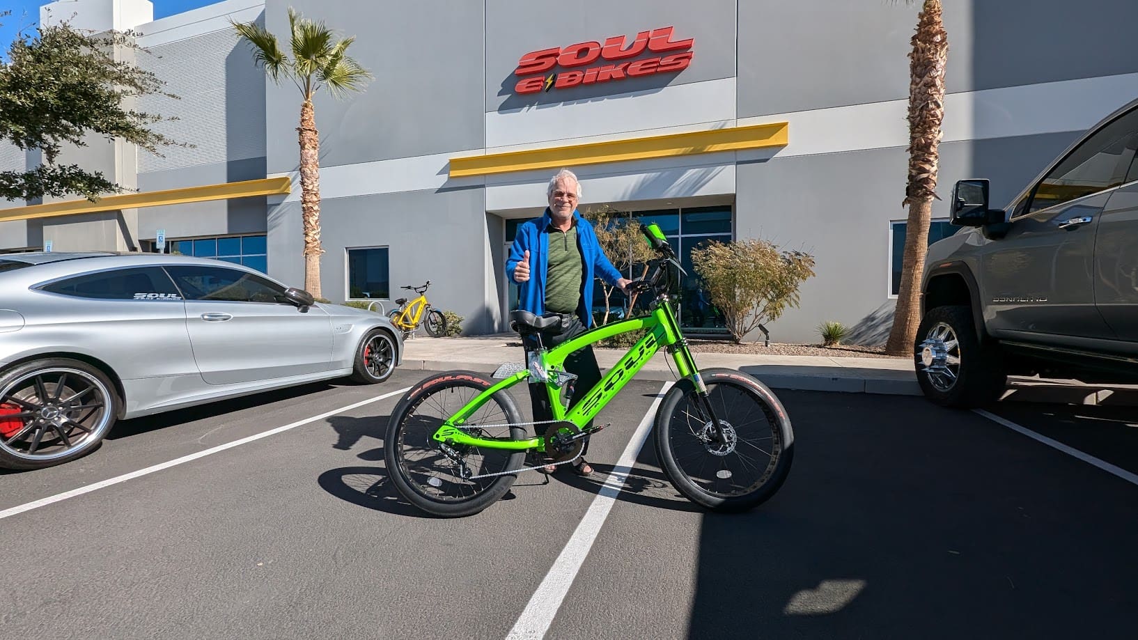 Man with green bike outside Soul e Bikes.