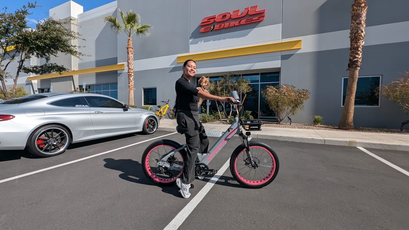 Person with bike outside a building.