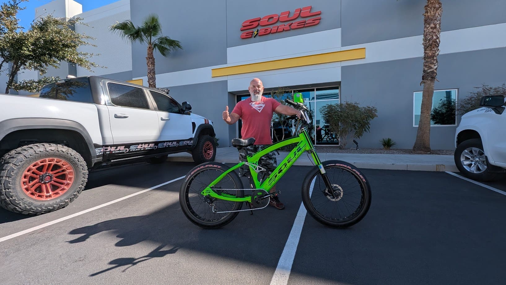Man with green bike outside Soul E Bikes.