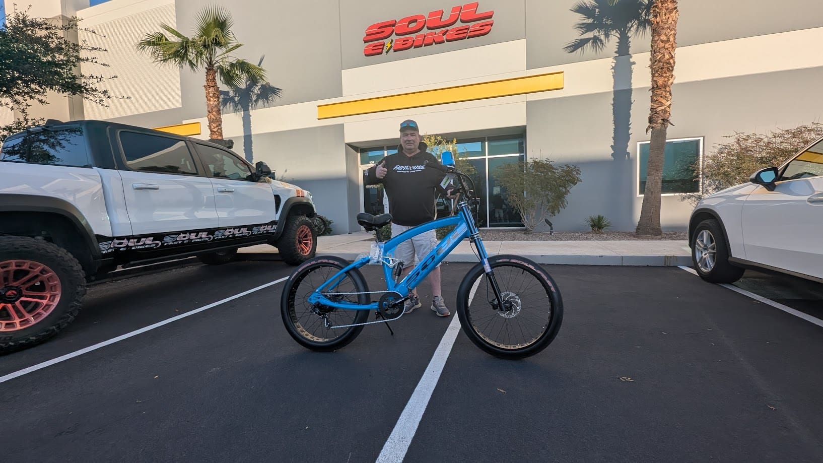Person with blue bike outside Soul Bikes.