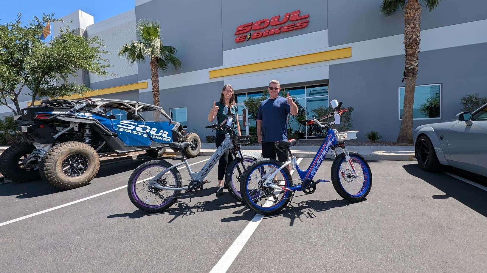 Two people with bikes at Soul showroom.