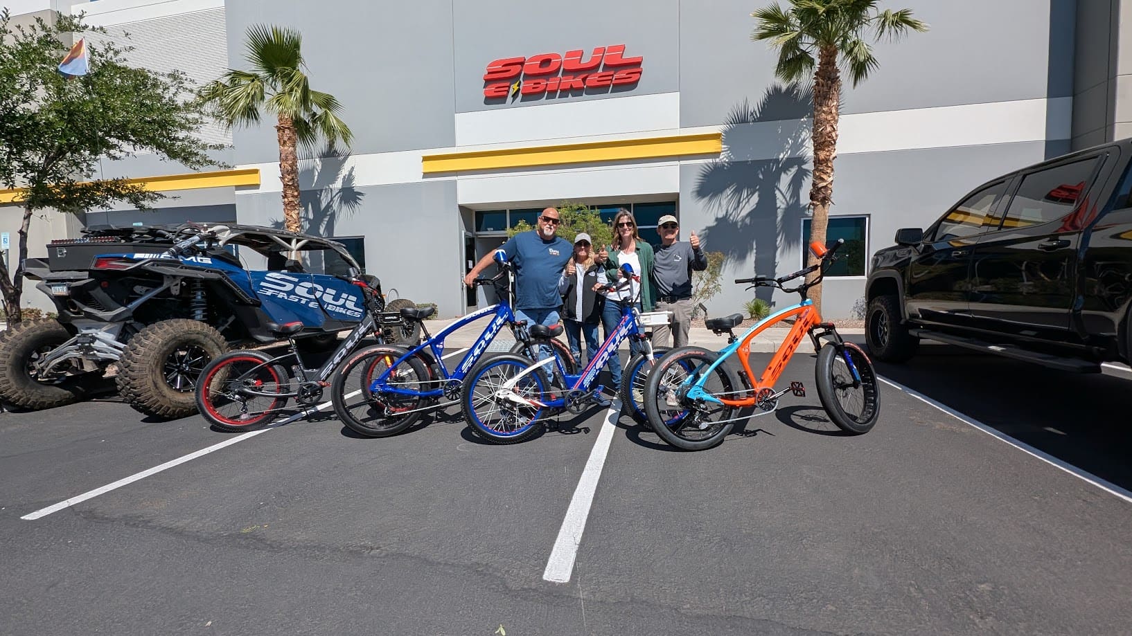 Group with bicycles outside Soul Bikes building.