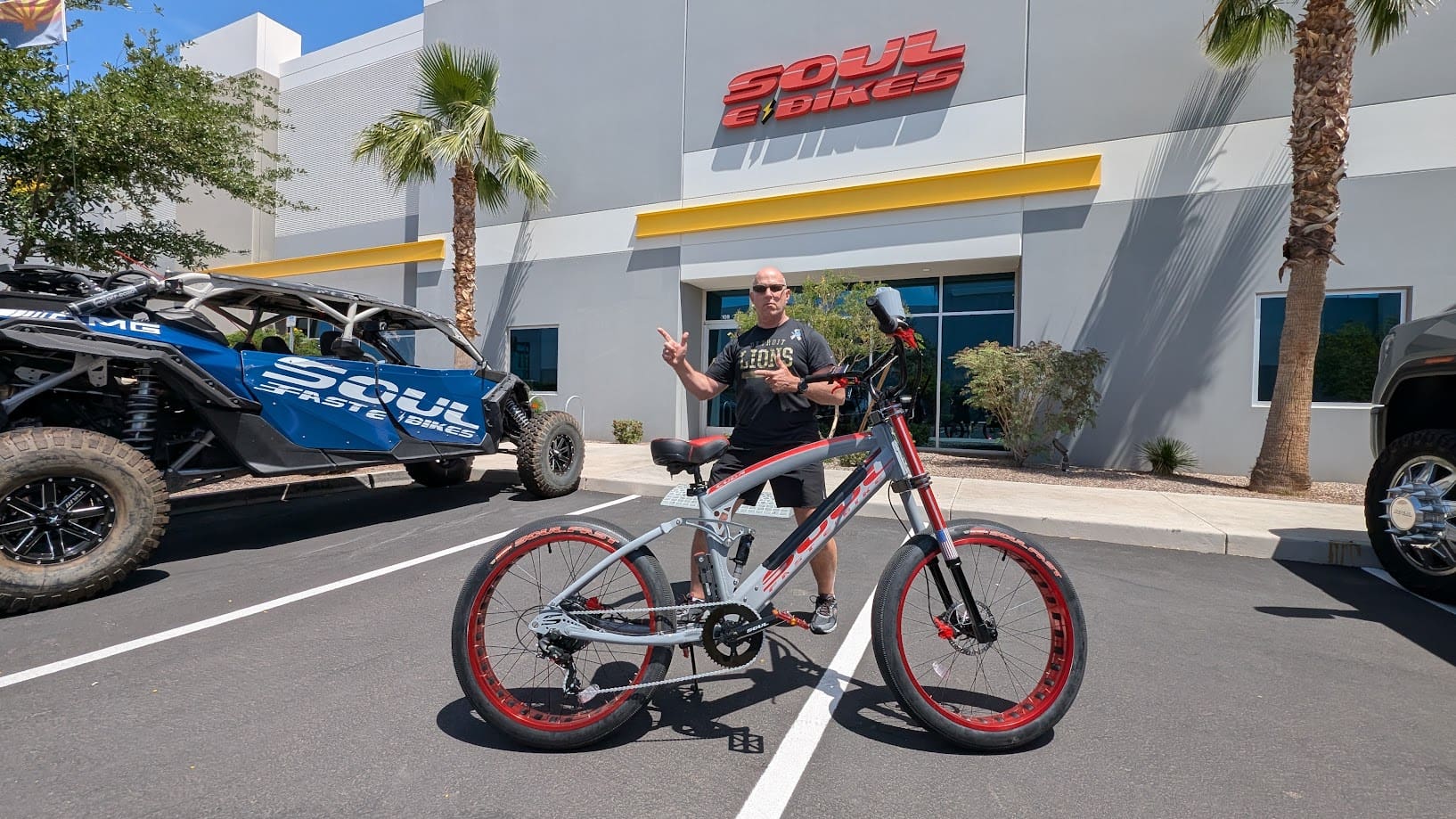 Man posing with bike outside Soul Bicycles.