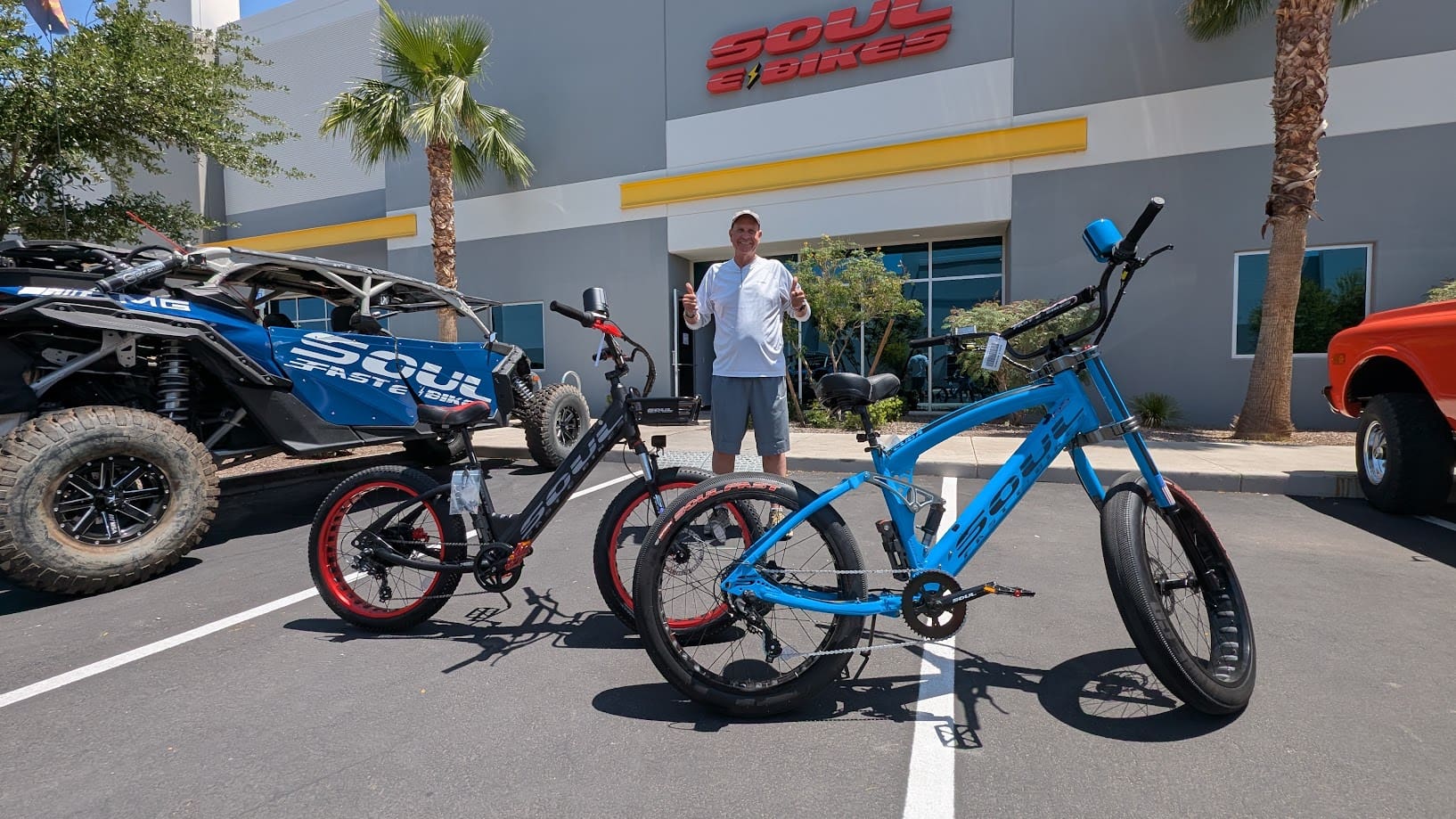 Two bicycles displayed outside a bike shop.