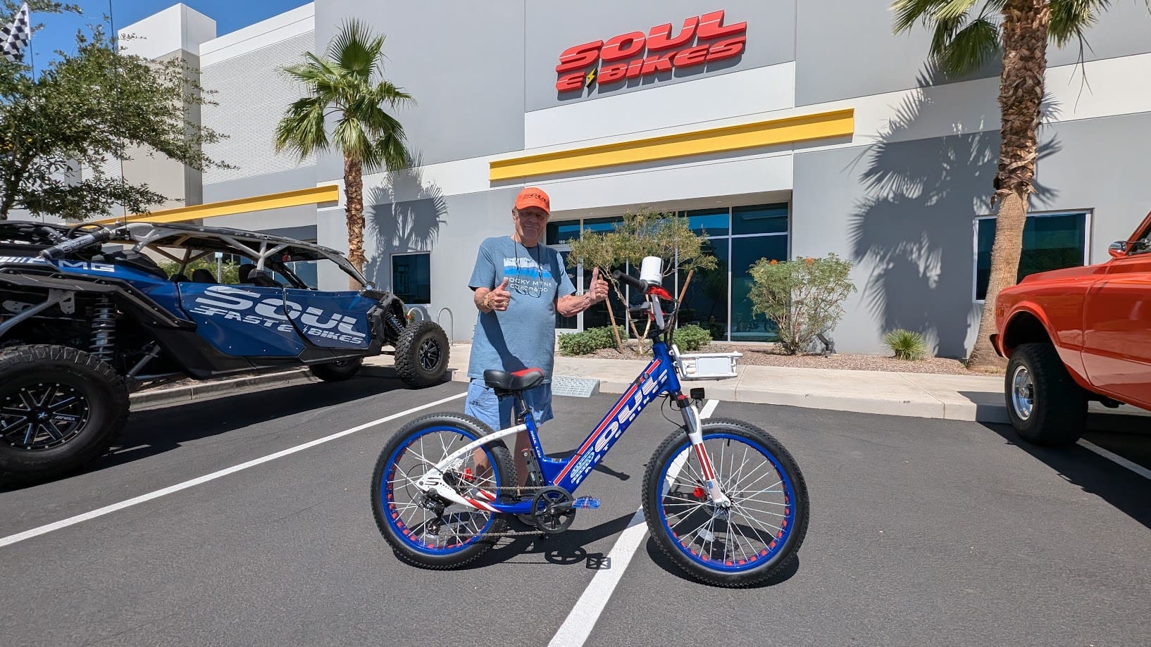 Man posing with bicycle outside Soul E Bikes.
