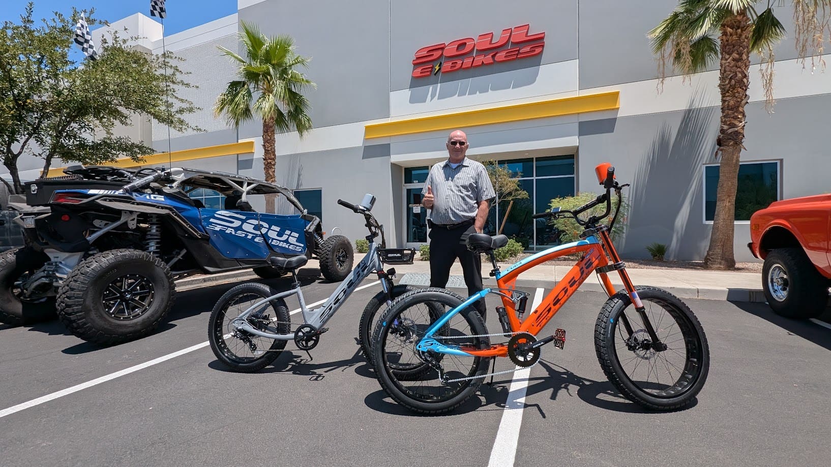 Man with bikes outside Soul Bikes store.