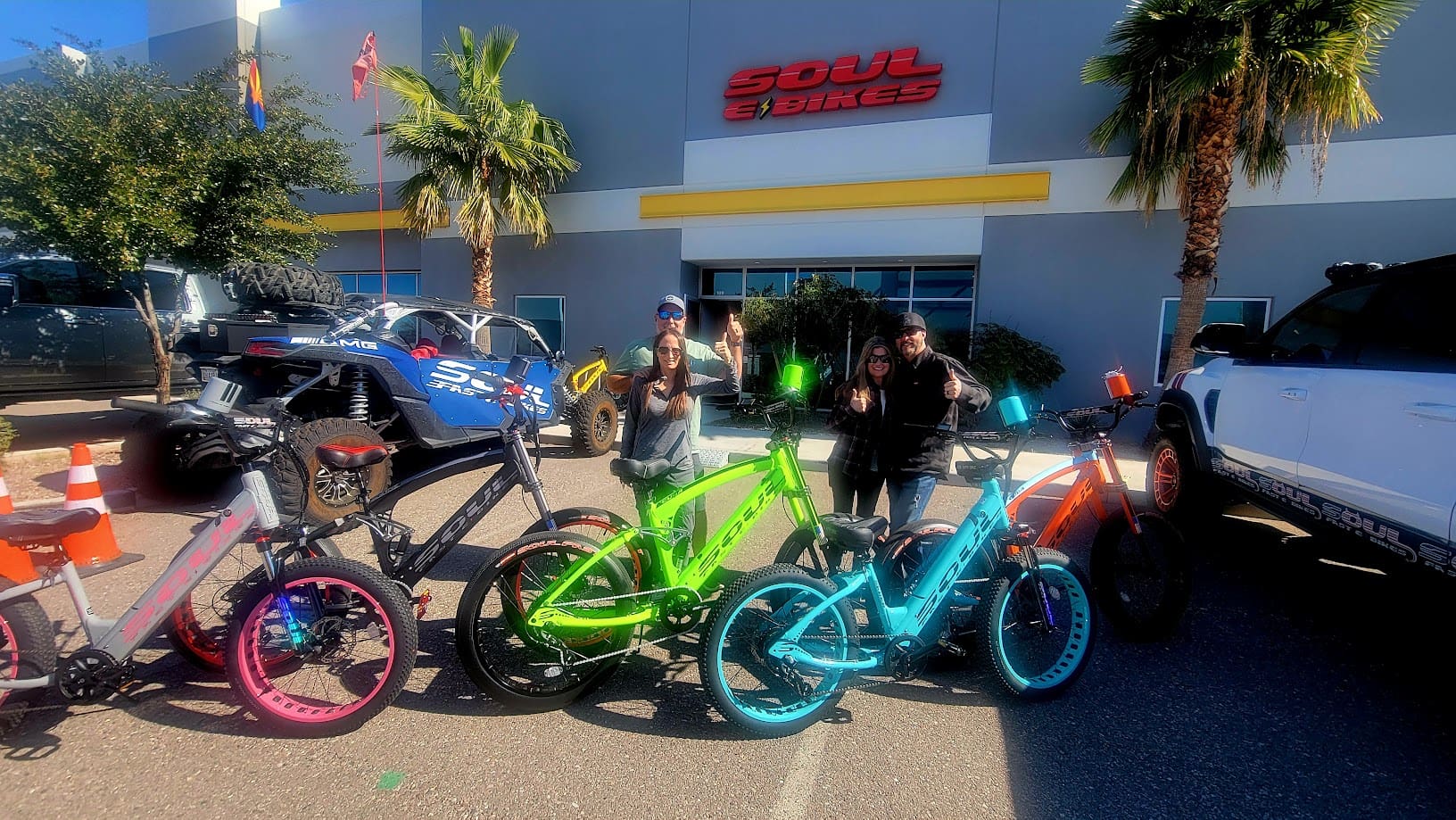 Colorful bicycles displayed outside a store.