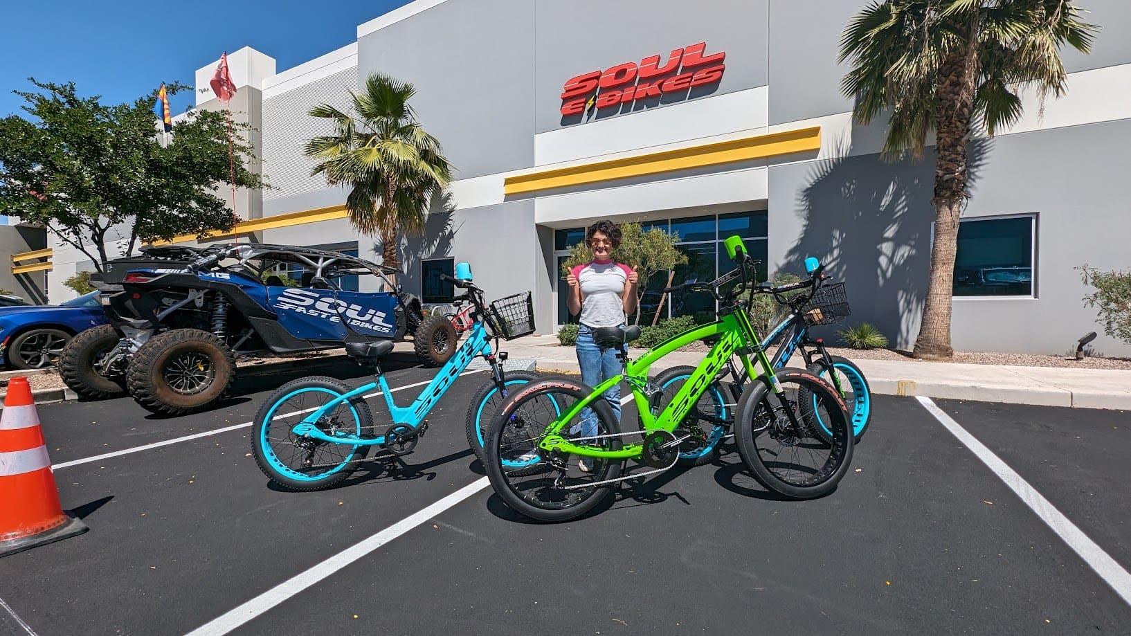 Person with bikes outside Soul Bikes store.