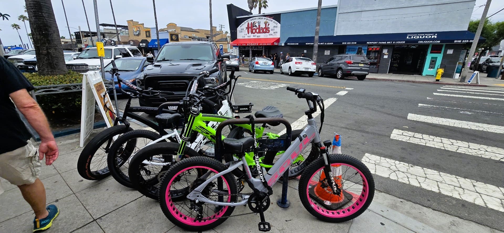 Bicycles parked on a city street corner.