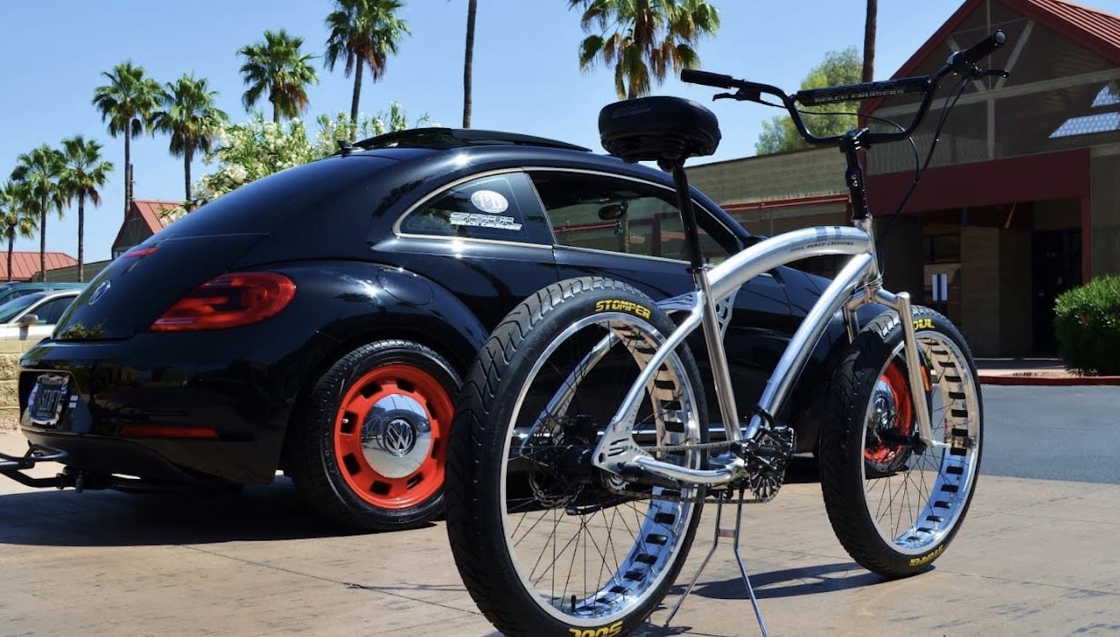 Bicycle and car parked in sunny area.