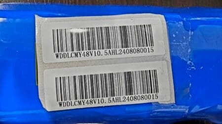 Barcodes on blue packaging with text labels.